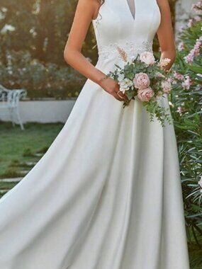 Elegant White Sleeveless Maxi Gown with Floral Waist Detail